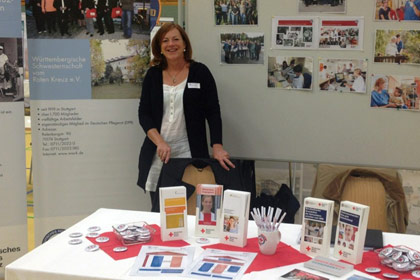 Frau Str&ouml;bel am Stand 
                der WSSRK bei der Interkom 2014.